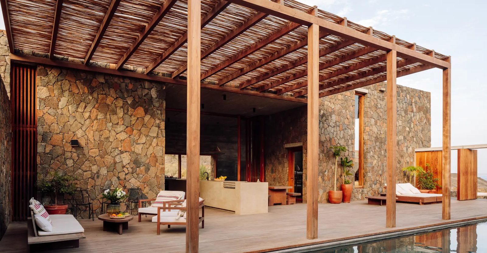 Barefoot Luxury, stone villa entrance with wooden shutters