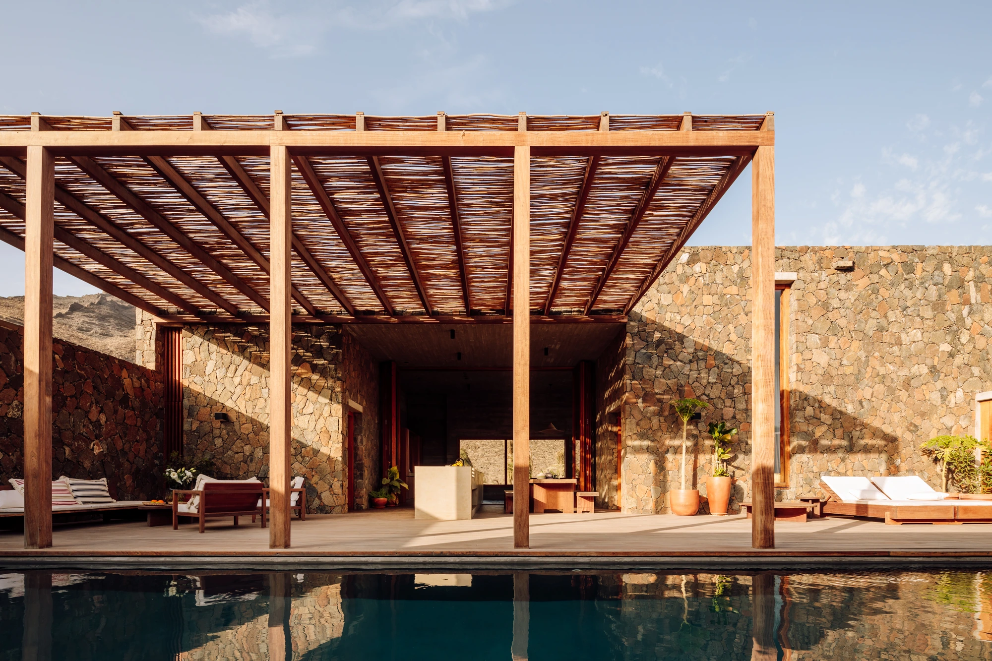 Luxury villas Cabo Verde, pool pergola with reed roof and open living, São Vicente