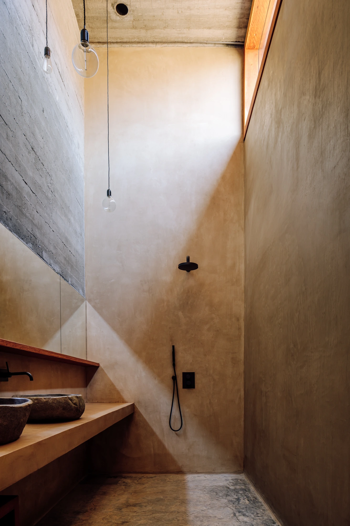 Real Estate Cabo Verde, concrete bathroom with rain shower and stone basins